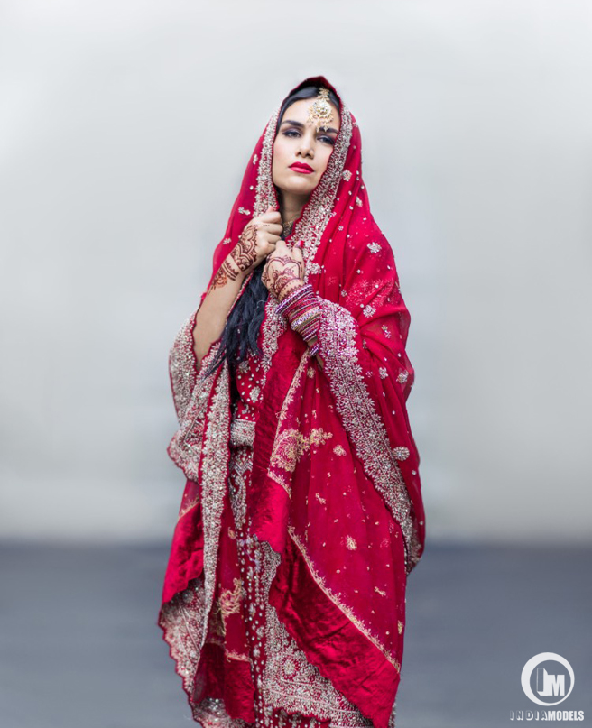New York based fashion model Monica Rahman wearing a gorgeous red bridal saree