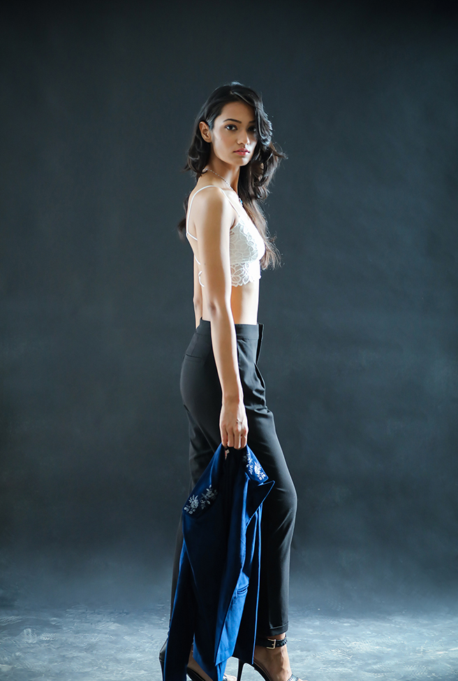 Mumbai based model Roopsi Gupta wearing a white lace top with office pants and high heels